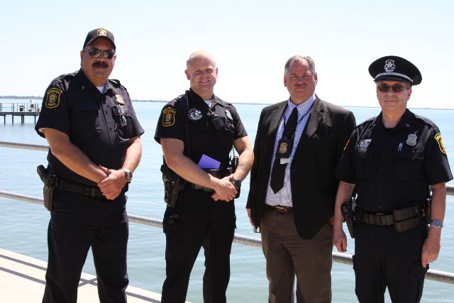 Police stand at the waterfront